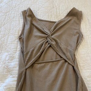 Womens tight dress. Details in the back (open) can be worn Vs versa. Used.